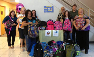 Biodex delivers backpacks to the Family Services League